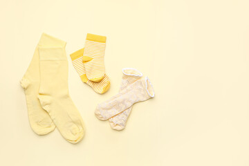 Set of cotton socks on color background