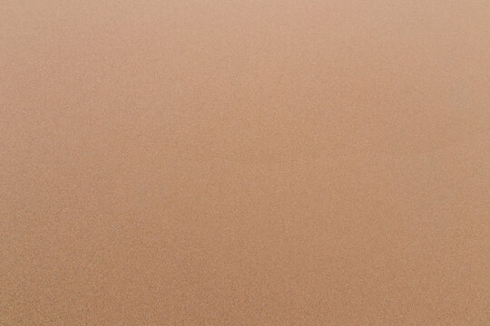 Sand texture background sandy beach top view.