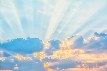 Naklejka na ściany i meble Sunrise sky with sun rays breaking through the clouds
