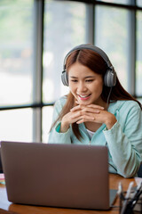Young asian student watching lesson online and studying . online education concept
