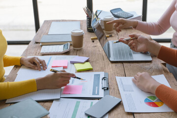 Group of creative meeting, hands of business marketing design and planning project on desk in office.

