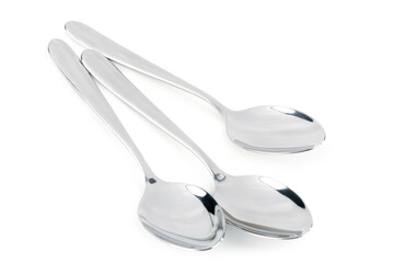Stainless steel spoons on white background