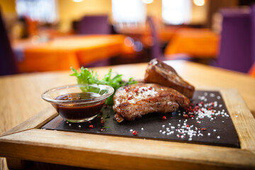 Pork breast on rib. Served with barbecue sauce