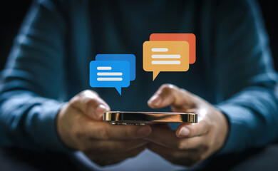 Human hand using smartphone typing Live chat chatting and social network concepts, chatting conversation working at home in chat box icons pop up. Social media marketing technology concept