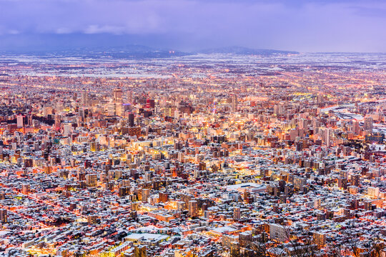 Sapporo, Japan aerial cityscape in winter at twilight.