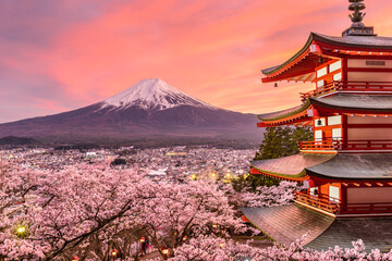 Fujiyoshida, Japan at Chureito Pagoda and Mt. Fuji in the spring with cherry blossoms.