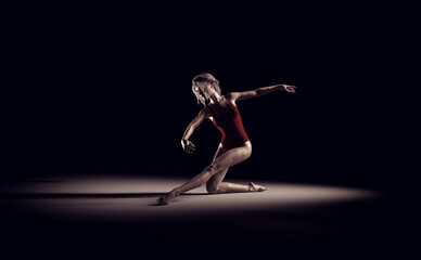 Fototapeta na wymiar Young and beautiful gymnast in red suit. This is a 3d render illustration.