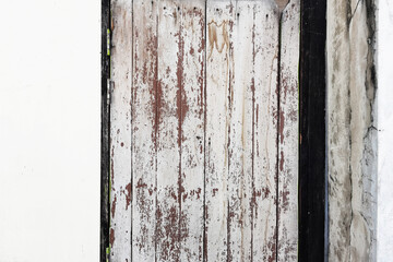 close up of wood door vintage in concrete wall 