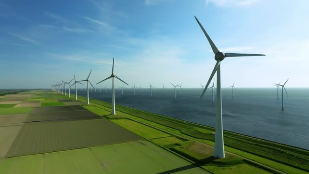 Wind Farm with Windmills near Urk Generating Sustainable Energy on Land and Sea in Netherlands