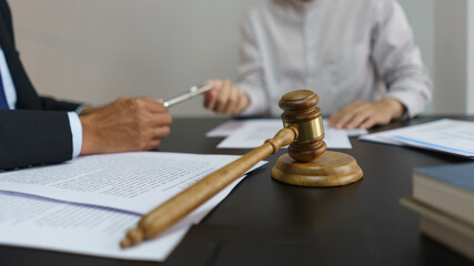 Concept of lawyer counseling, Businessman receives a pen from senior lawyer to signing contract