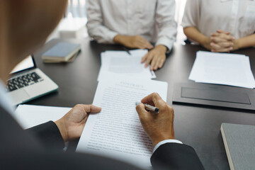 Lawyer and justice concept, Senior lawyer explains the divorce agreement and contract to couple