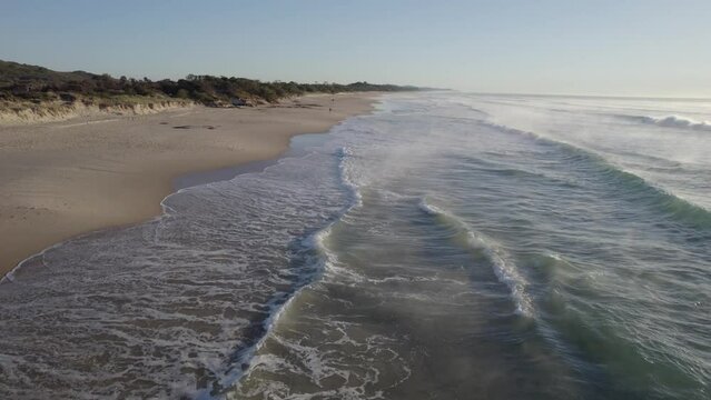 Sea Waves On Sandy Shoreline Of Beach During Sunrise  - Coolum Beach In Sunshine Coast, QLD, Australia. - aerial