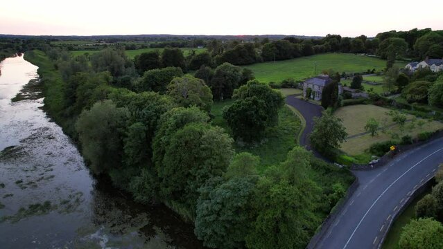 Aerial drone shot of Maigue River in Adare, Ireland, Limerick County. Rising