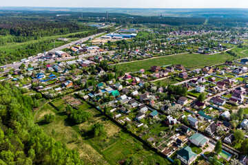 Country buildings near the highway, aerial view
