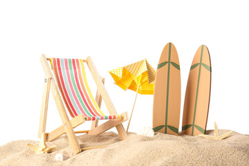 Mini surfboards with deckchair and umbrella on sand against white background