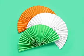 Indian flag made of colorful fans on green background