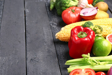 Fresh ripe vegetables on dark wooden background, closeup