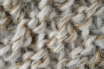 Grey, brown color wool knitted background closeup