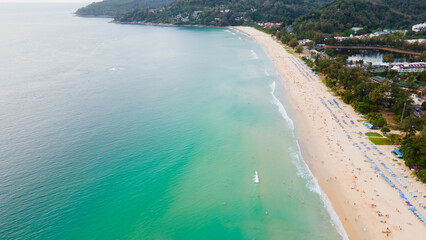 Kata Beach, Phuket Island, Thailand,  the blue sea blue sky and white sandy beach during summer time of southern Thailand. This famous beach is good for holiday vacation and sun bathing.