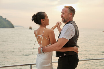 couple dancing on luxury yacht at the sea