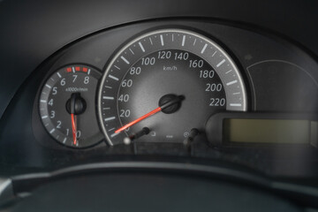 Car dashboard modern automobile control panel with speedometer and tachometer, close-up. Checking...