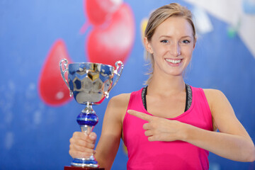 woman posing with her trophy