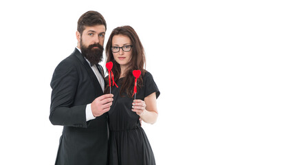 Celebrate anniversary. Married couple hold red hearts. Happy relationship concept. Trustful relations. Happy valentines day. Couple in love. Family couple. Bearded man hug woman. True feelings