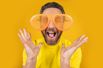 photo of surprised party man has summer fun in glasses. party man has summer fun