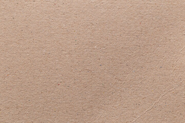 Brown color eco recycled kraft paper sheet texture cardboard background.