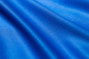 Blue color sports clothing fabric football shirt jersey texture and textile background.