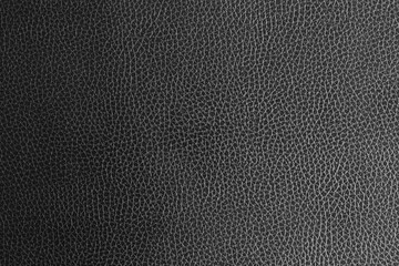 Black leather and a textured background.