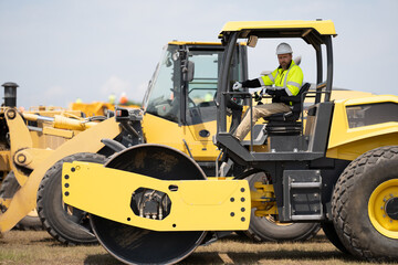 construction machinery worker outdoor. machinery in manufacturing industry with construction worker. construction worker used heavy machinery. construction industry with machinery worker