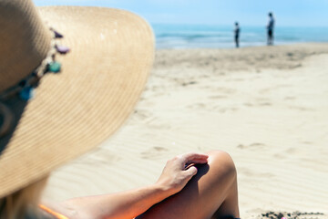 a girl in a hat, a close-up on the girl's tanned and slender legs, there is place for an inscription