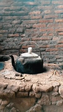 Aesthetic rustic video traditional kitchen with clay stove and kettle smoke