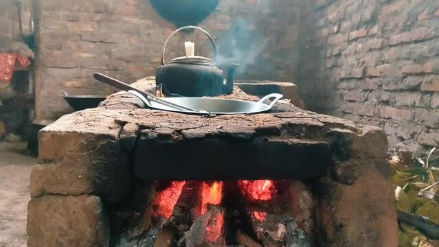 Aesthetic traditional kitchen with stove, pan and kettle, cooking