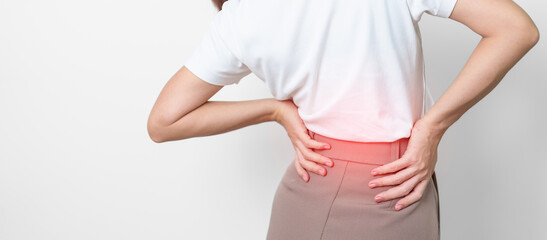 adult female with muscle pain on gray background. Elderly woman having back body ache due to...