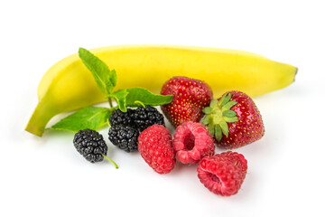 Berries on a white background. Strawberry, mulberry, banana, raspberry, mint leaves.