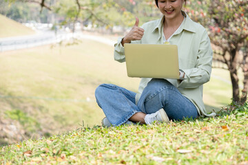 Woman having video call at park.