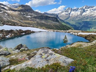 Naklejka na ściany i meble Little Alpine Lake in the Italian Alps, Rieserferner, Europe