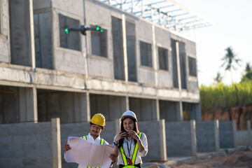 Aerial Survey by Two Professionals  Asian engineer at a Construction Site, Advancing Architectural Innovation and Infrastructure Development