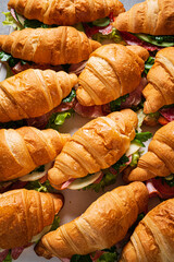 croissants with ham on catering table