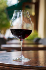 glass of red wine on terrace