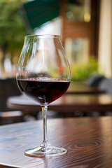 glass of red wine on terrace