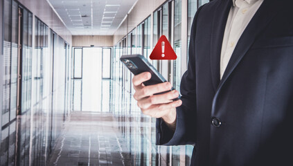 concept, warning or alert, technology scam, user showing warning access to dangerous cyber attack virus software or threats to hack online network, technology security with smart phone