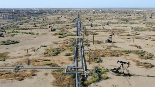 Long pipeline for oil in large oil field, aerial view