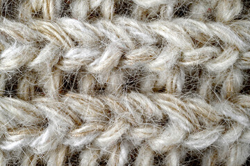 Grey, brown color wool knitted background closeup