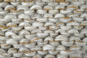 Grey, brown color wool knitted background closeup