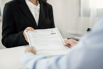 HR Manager talks to job applicants for job interviews about careers and Her personal history in the...