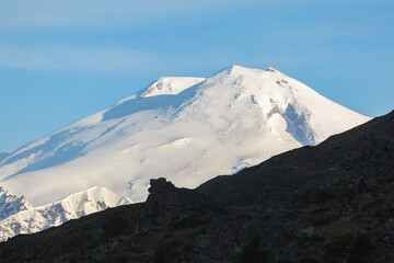 Snowy slopes of Mount Elbrus against the blue sky