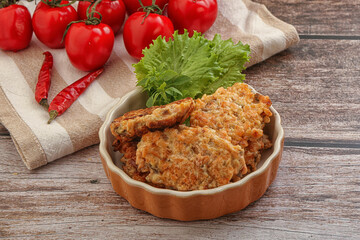 Fried salmonn cutlet in the bowl